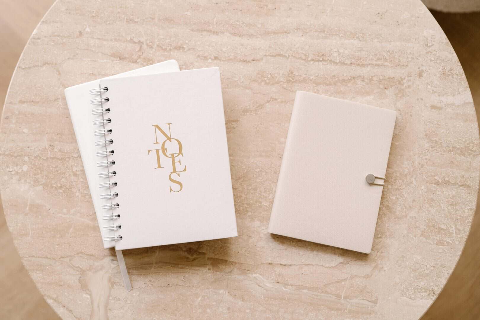 Minimal printable planners on marble table, designed for moms who need focus and clarity.